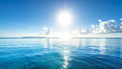 Fototapeta premium Sunny day over ocean, bright sun with reflective water