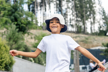 young mixed-race boy smiles while running towards trampoline
