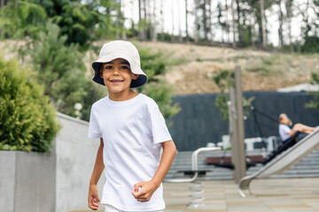 Young boy jumping on outdoor trampoline in park