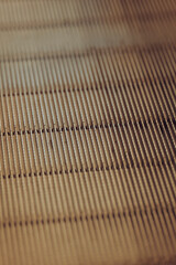 A detailed close-up of an escalator’s patterned metal steps.