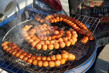 Grill I-san pork meat sausage on barbecue grill