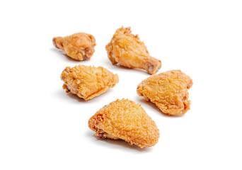 Grilled chicken wings on a white background.