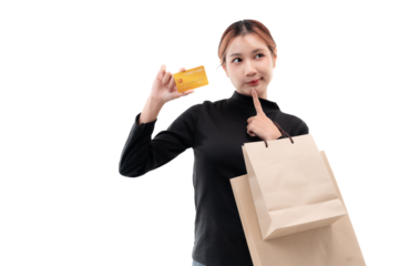 Happy young woman holding credit card and shopping bags on transparent background.