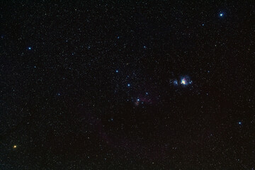 Obraz premium Night blue sky space background with great orion nebula (M42 ) and Running Man Nebula (M43) , Milky way galaxy with stardust field in deep universe