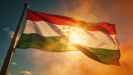 Tajikistan's flag beautifully illuminated by a sunset, perfect for patriotic themes or travel brochures.