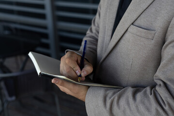 Close-up of a businessman working on a tablet, focused and serious