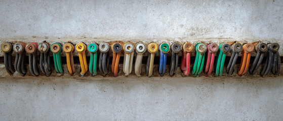 A detailed shot of colorful electrical wires neatly arranged and connected in a row