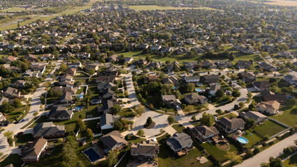 Aerial view of suburban neighborhood houses on sunny day