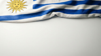 Fototapeta premium Flag of Uruguay with blue and white stripes on a neutral backdrop, ideal for educational materials or cultural events highlighting national identity.