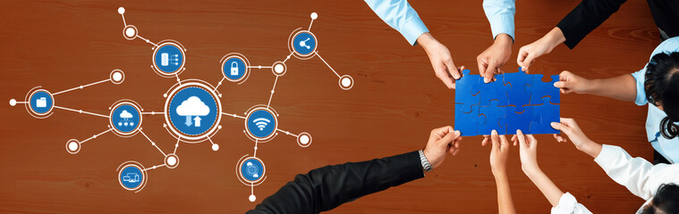 A diverse team collaborates in a computing environment, showcasing cloud technology and connected devices. The image highlights teamwork and innovation in a professional setting. Amity