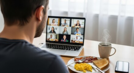 Man having virtual breakfast meeting on laptop with multiple colleagues. Remote work and online communication concept for business professionals.
