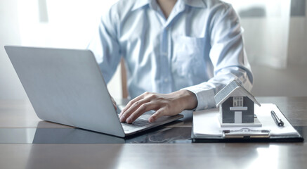 home dealer businessman signing home insurance document or lease paper. home loan and insurance concept