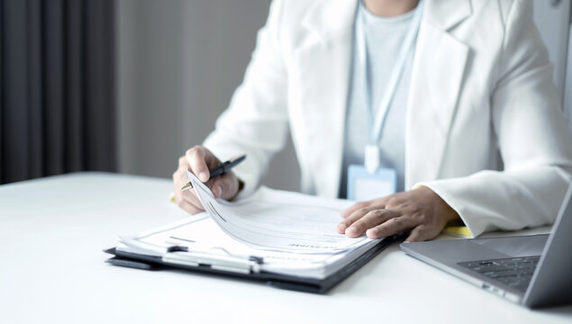 Business woman employer holding resume hiring recruit looking cv resume to hire candidates, analyzing information before job interview. Recruitment concepts