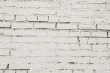 Weathered white brick wall texture with visible mortar and imperfections