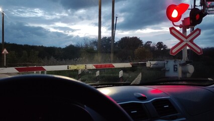 Working signal at a railroad crossing, prohibiting entry. View from inside a car. Video with sound