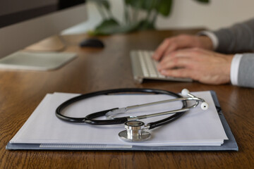 medicine, medical diagnosis, stethoscope and doctor hands closeup
