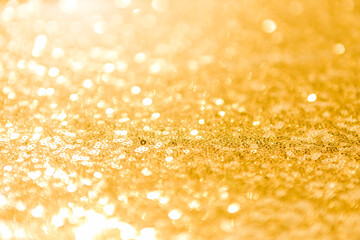 Close up blurred gold bokeh background, abstract shiny gold texture background