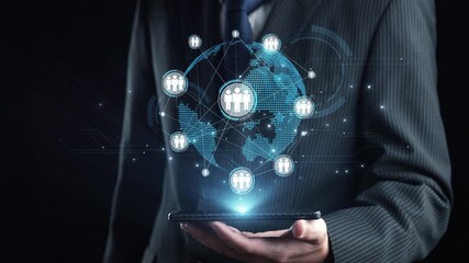 A professional businessman in a suit holds a smartphone displaying digital connections and human icons, symbolizing modern communication and global networking. Qubit - Powered by Adobe
