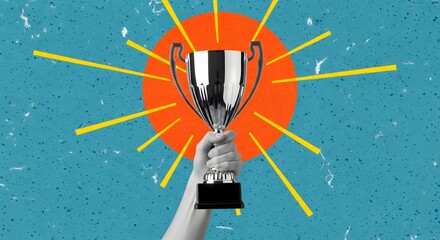 Hand holding a silver trophy against a bright orange sunburst on a textured blue background