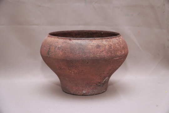 An old cast iron pot for cooking in the oven