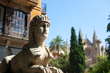 Historical Stone Sphinx Sculpture with La Seu Cathedral in Background, Palma de Mallorca, Spain