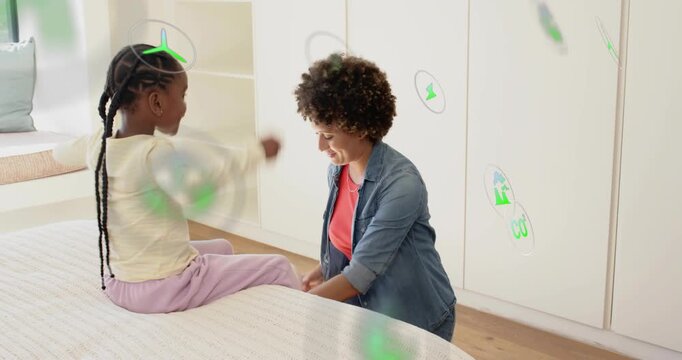 Mom kneeling bedside tying white wrap for health after child holding leg green dots floating around