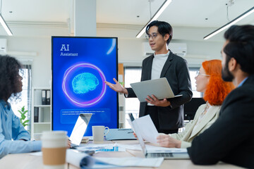 Diverse creative team use Ai Assistant (artificial intelligence assistant) on AI-assisted display for Marketing Data Analyst meeting at office.Coding team,develop Ai Assistant,business brainstorming