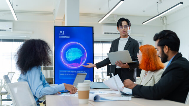 Diverse creative team use Ai Assistant (artificial intelligence assistant) on AI-assisted display for Marketing Data Analyst meeting at office.Coding team,develop Ai Assistant,business brainstorming - Powered by Adobe