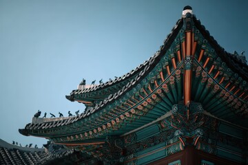 Traditional Asian architecture featuring ornate roof design with vibrant colors and intricate details, showcasing cultural heritage and craftsmanship in a serene environment