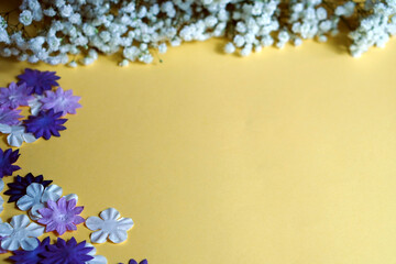 Yellow background with delicate purple and white flowers