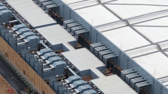 Aerial close-up view of a large data center showing servers, cooling systems, and digital infrastructure used for AI computing, cloud processing, and high-performance big data operations.