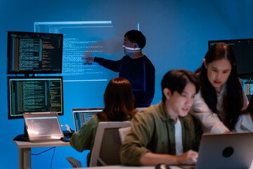 Asian software engineer or programmer team working late in development office,problem solving or algorithm of ai assistant helping for work.software developer,digital technology security concept