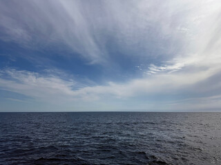 Fototapeta premium Wide ocean sky clouds horizon.