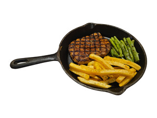Grilled steak with french fries and green beans served in a cast iron skillet.