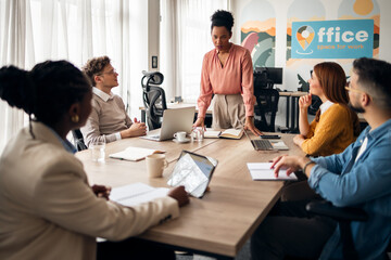 Team Collaboration During a Business Meeting in Modern Office Setting