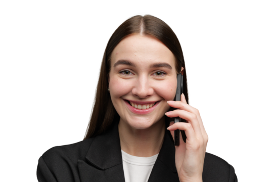 Woman smiles while talking on the phone indoors - Powered by Adobe