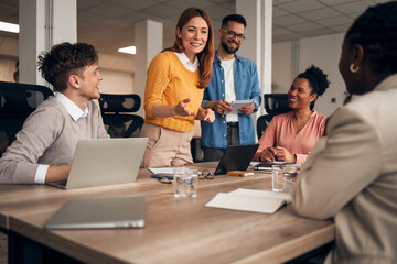 Creative Business Meeting with Colleagues Smiling and Collaborating Together