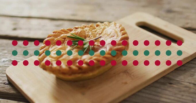 Shot starting, camera pushing right while focus tightening on hand pie to highlight rosemary sprig