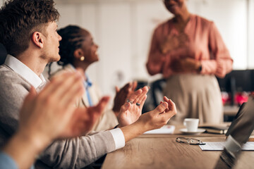 Business Team Applauding a Presentation in a Modern Office Setting