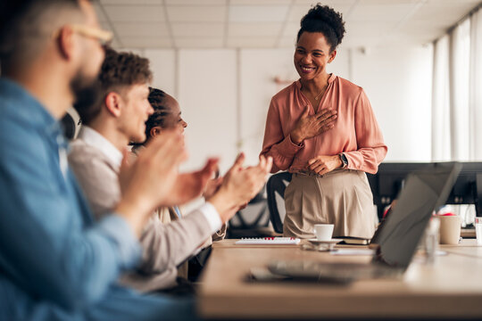 Professional Team Shares Gratitude and Celebrates Achievement in Office Setting