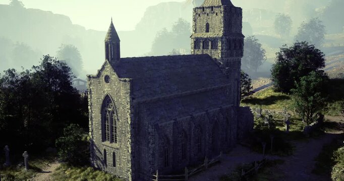 A stone church stands proudly amidst verdant trees and rolling hills. Sunlight illuminates the structure, highlighting its architectural details during a peaceful day.