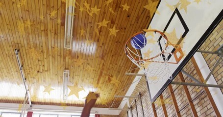 Maroon shooter trying layup school, navy player tipping blue ball in rim, gold stars overlay - Powered by Adobe