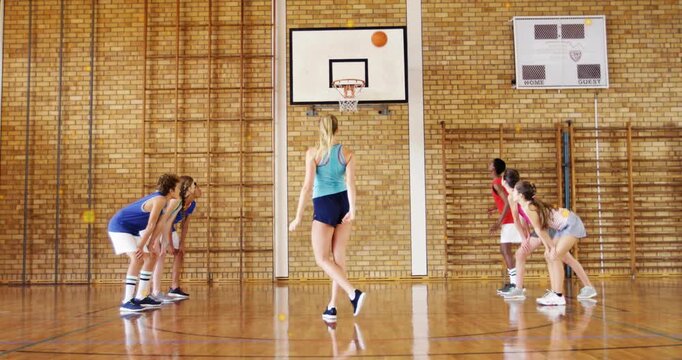 Female shooter jumping and releasing basketball animated arc tracing rim deflection during PE drill