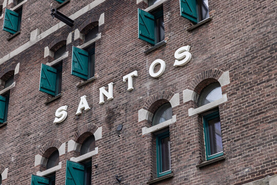 Close-up of the historic Santos warehouse facade (now the Nederlands Fotomuseum), showing large white 3D letters spelling the name Santos. Rotterdam Netherlands, 15 November 2025.