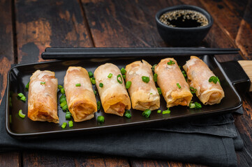 Fried spring rolls Lumpia crunchy appetizer with soy sauce and scallions minimal Asian food concept