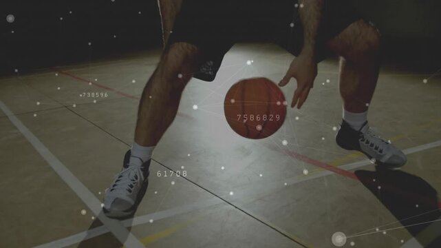 Male basketballer starting low dribbling thru legs switching hands training nodes around ball, feet