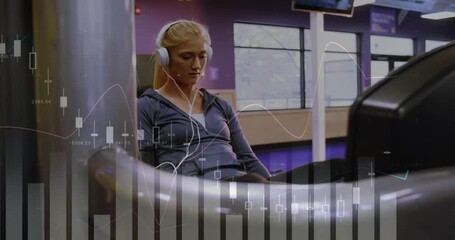 Woman starting leg-press by pushing platform, doing reps for fitness, financial charts overlaying - Powered by Adobe