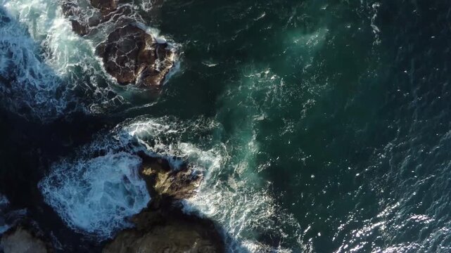 Sea waves crashing against rocks