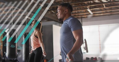 Two exercisers jumping rope on first swing, teal charts sweeping over them for fitness - Powered by Adobe