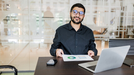 Man presenting business report in modern office setting